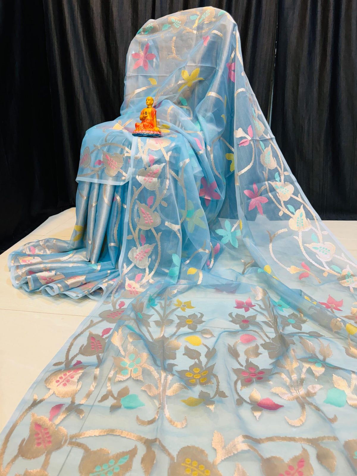 Pastel Sky Glow – Handcrafted Pure Muslin Saree with Gold Border & Multicolor Floral Motifs