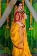 Sunshine Yellow Khadi Handcrafted Designer Saree with Gold Buti & Red Traditional Border – Festive & Wedding Special