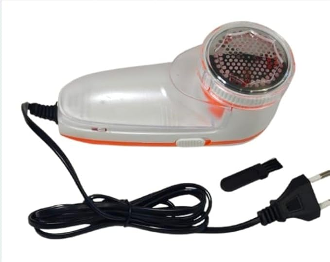 White and orange Nova lint remover with cord and cleaning brush