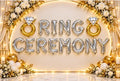 Ring Ceremony backdrop features a stunning arrangement of foil balloons, floral accents, and warm - 21262